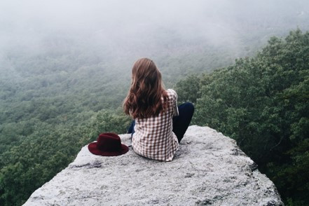 High achieving woman in Texas reflecting on the difference between personal worth and accomplishments